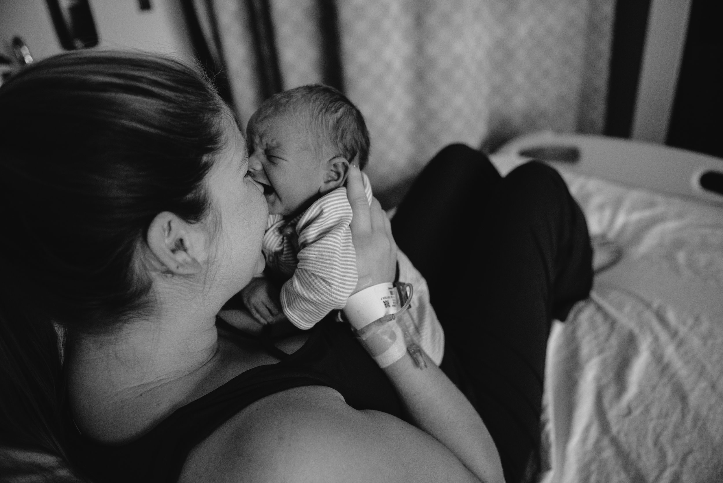 mom with baby to nose-pensacola newborn photographer