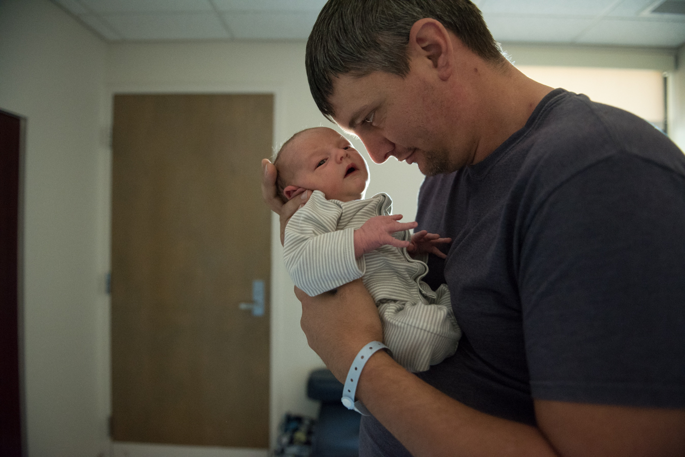dad with baby to face-newborn-pensacola photographer