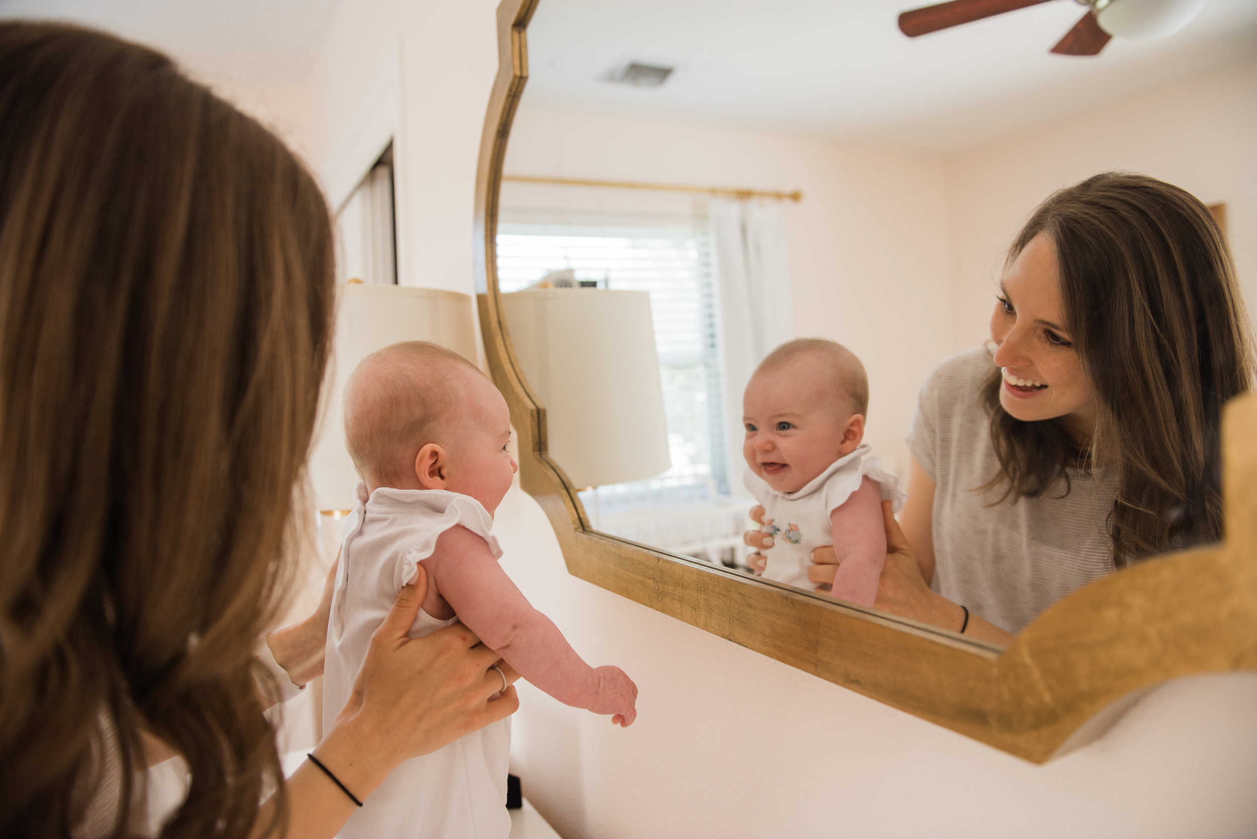 baby and mom in mirror-Pensacola Lifestyle Photographer