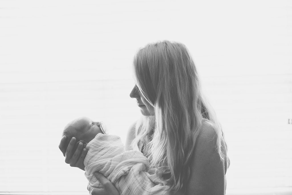 mom holding baby-Gulf Breeze newborn photographer