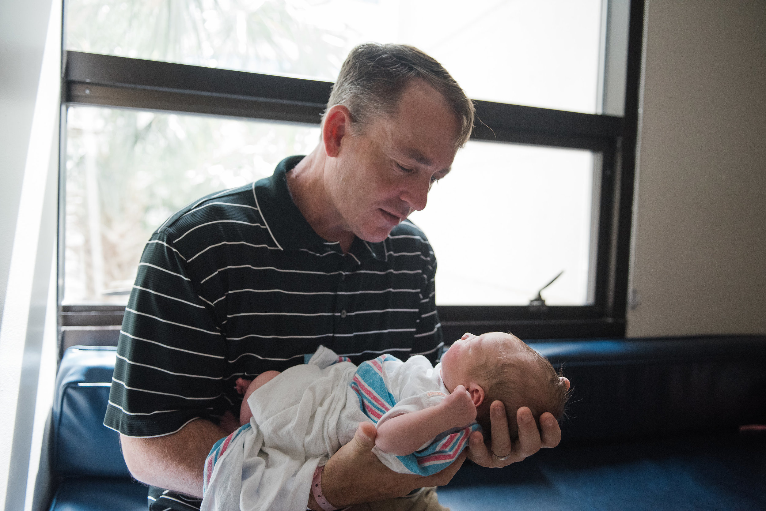 dad with baby-fresh 48 pensacola photographer