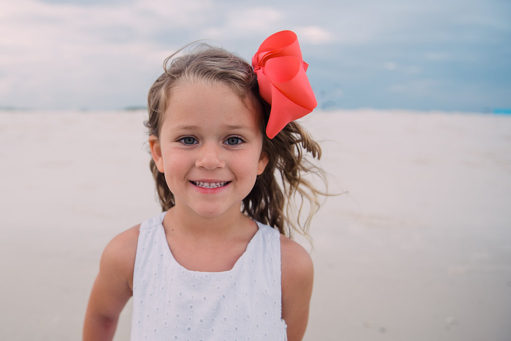 girl with bow at beach-pensacola photographer