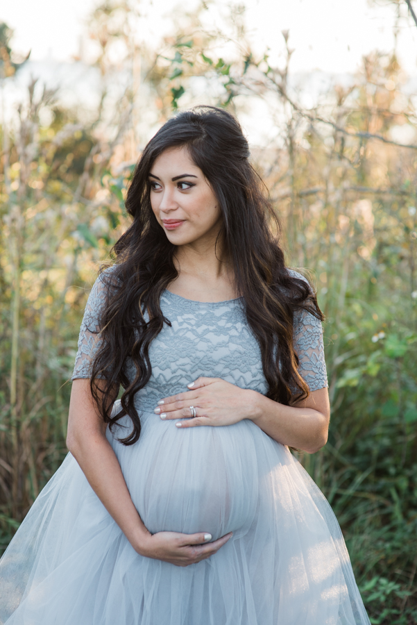 girl holding pregnant belly-Pensacola maternity photographer