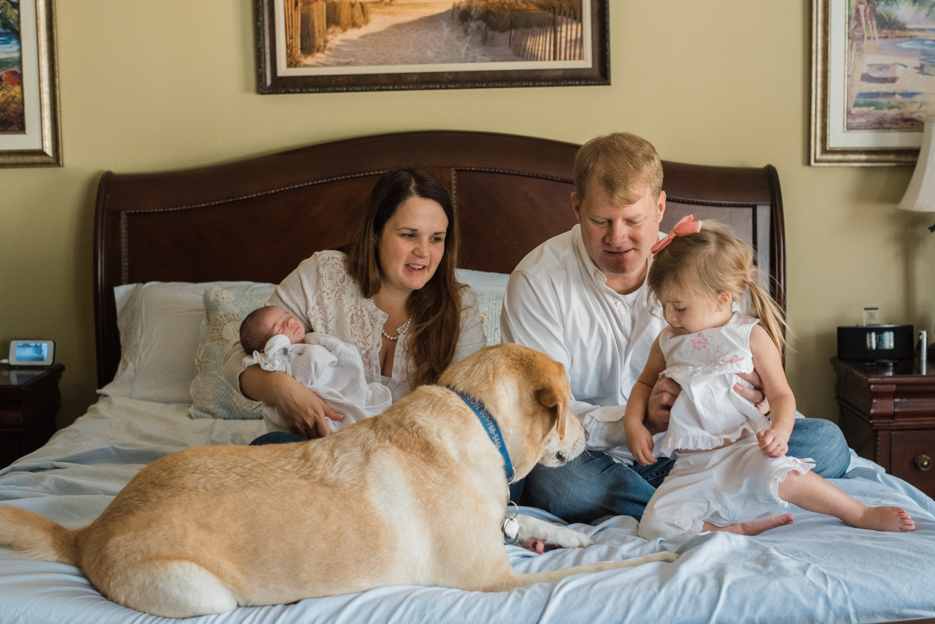 family on bed with dog-Pensacola newborn photographer