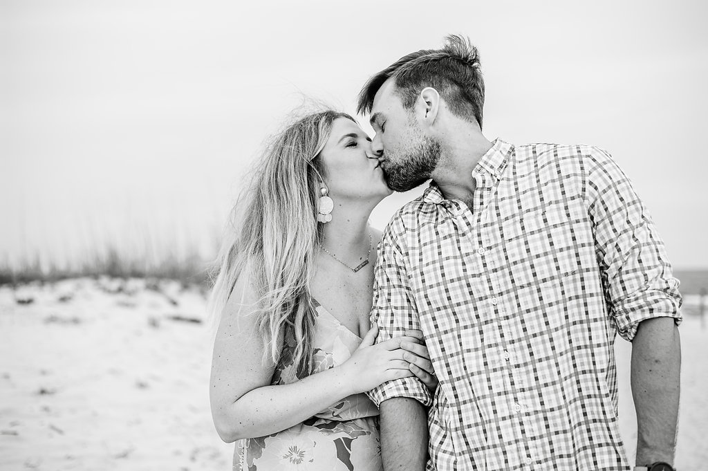 couple kissing at beach-Pensacola Beach Lifestyle Photographer
