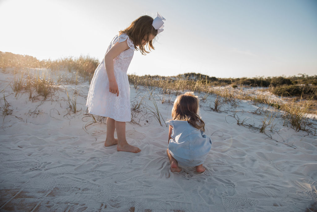 girls playing in sand-pensacola beach family photographer