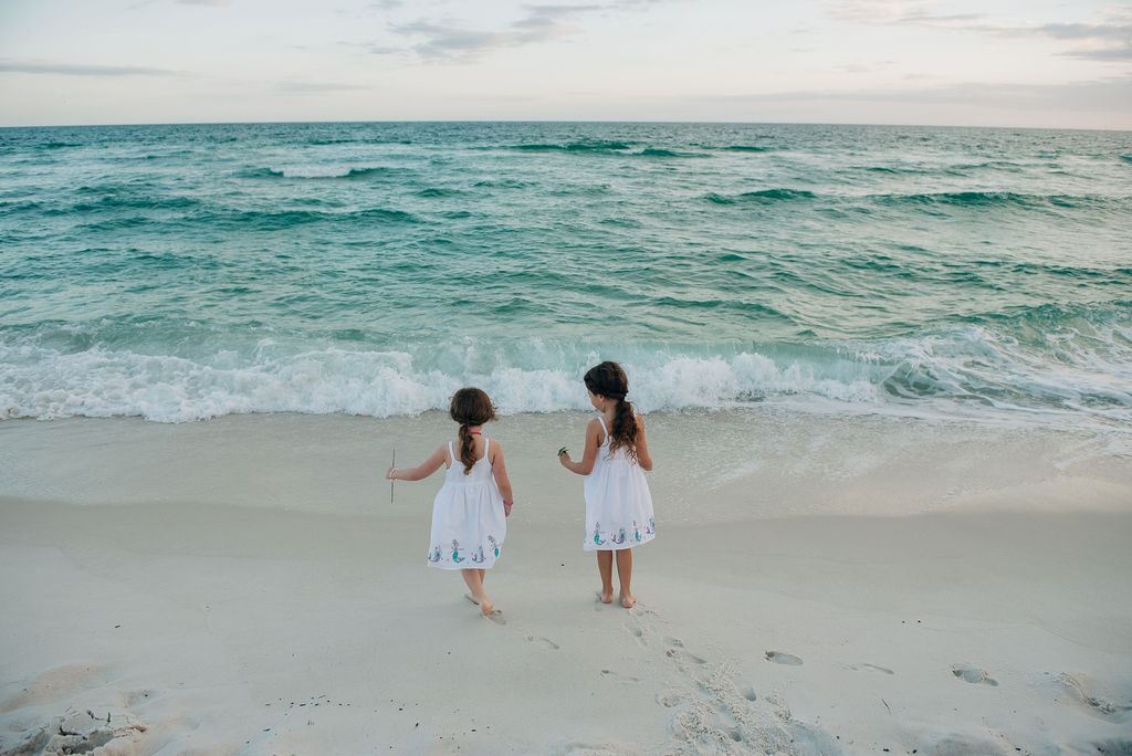 girls by ocean-pensacola beach family photographer