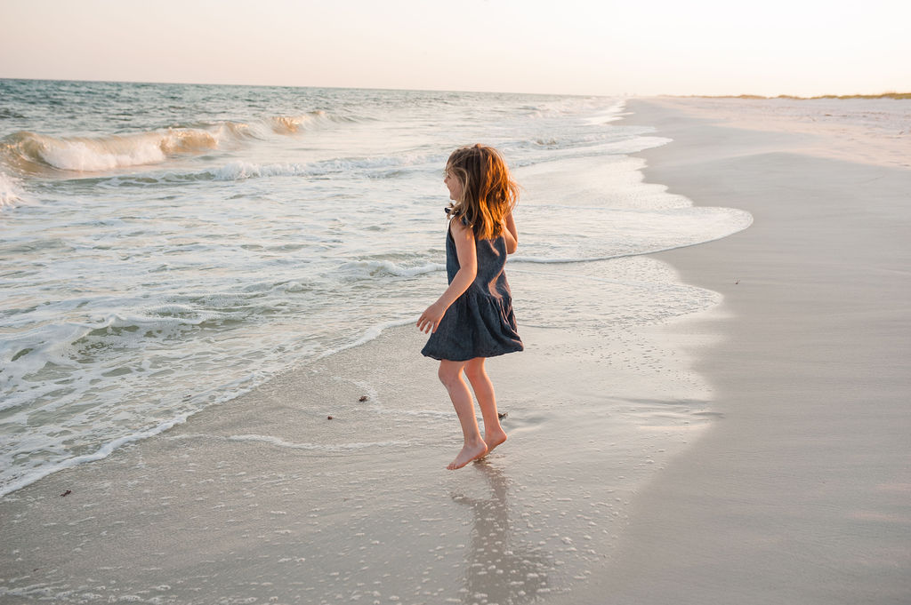 girl jumping waves-Pensacola Beach Photographer