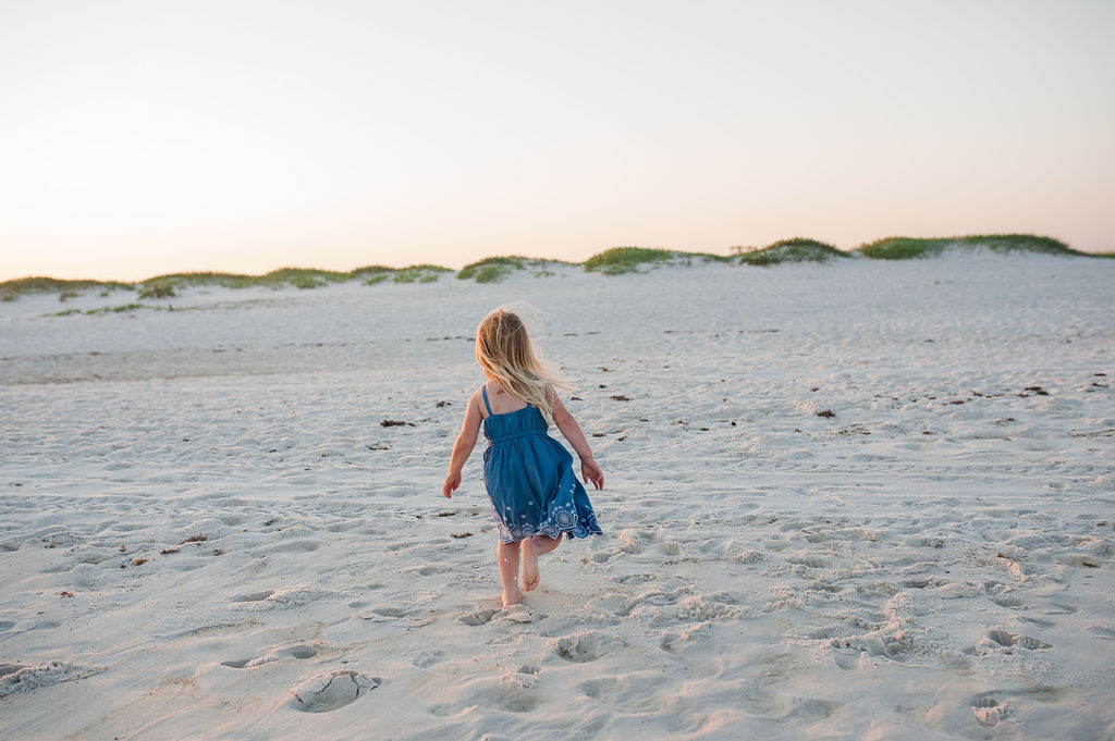 girl running on beach- Navarre Beach Photographer