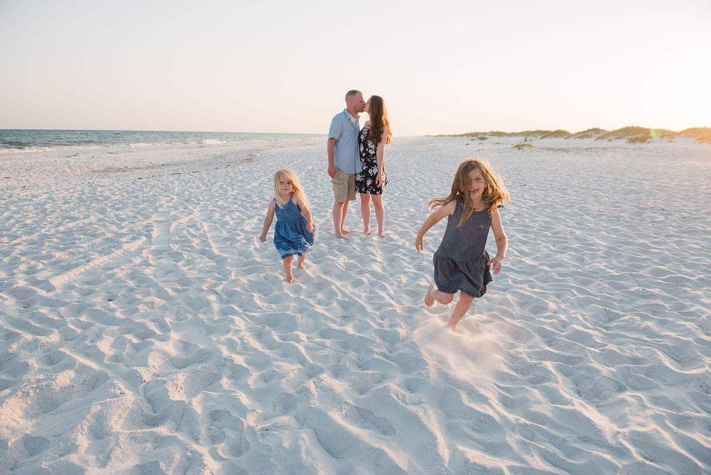 running on beach-pensacola beach family photographer