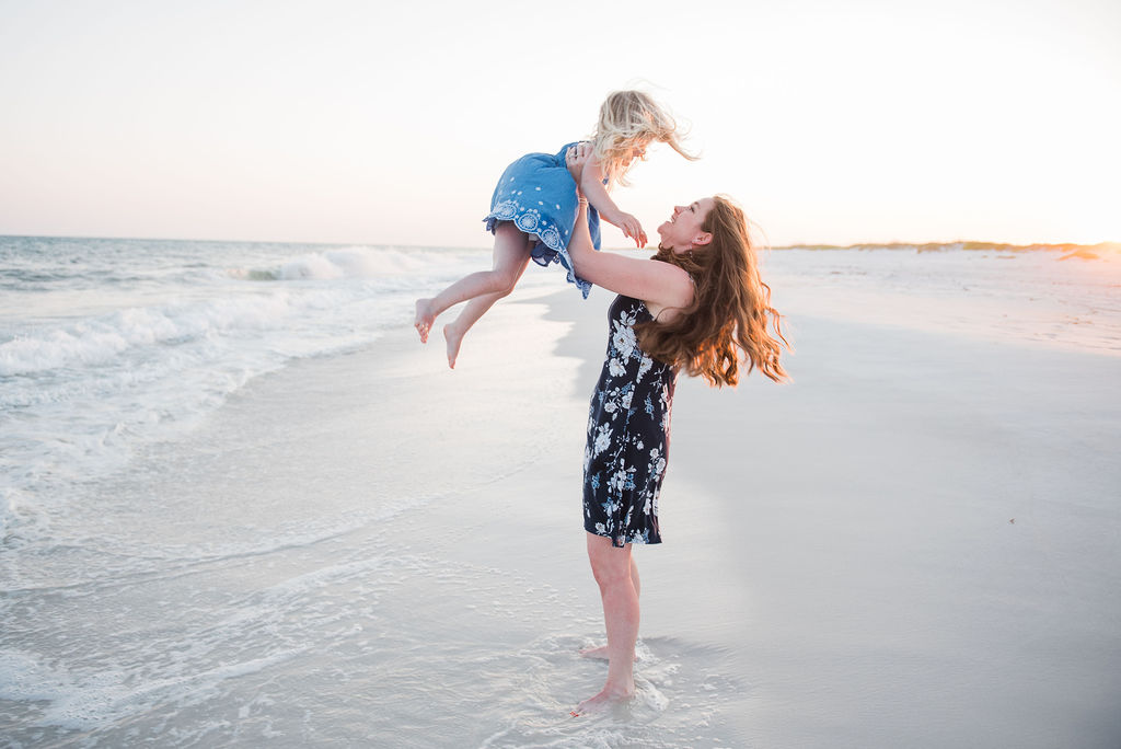 mom twirling daughter-pensacola beach family photographer