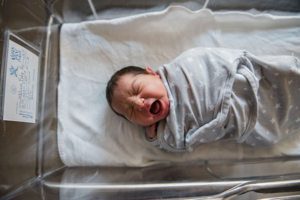 newborn in bed-pensacola newborn photographer