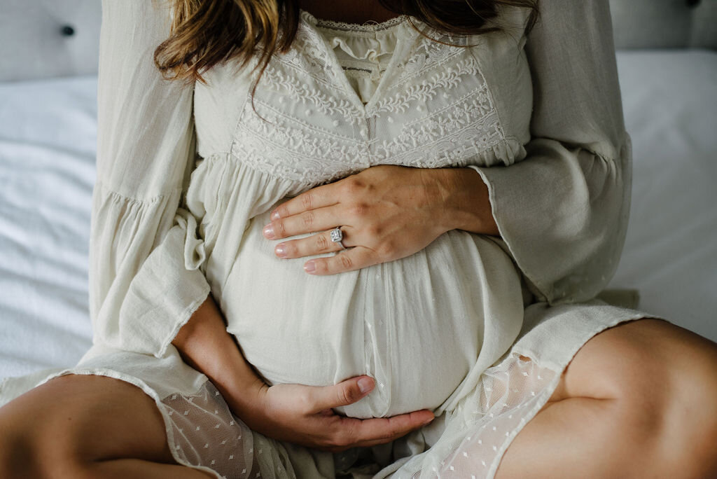 mom with hands on belly-Pensacola maternity photographer-Ann Mangum Photography