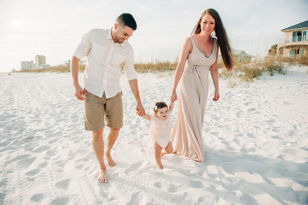 mom and dad with baby at beach-pensacola family photographer