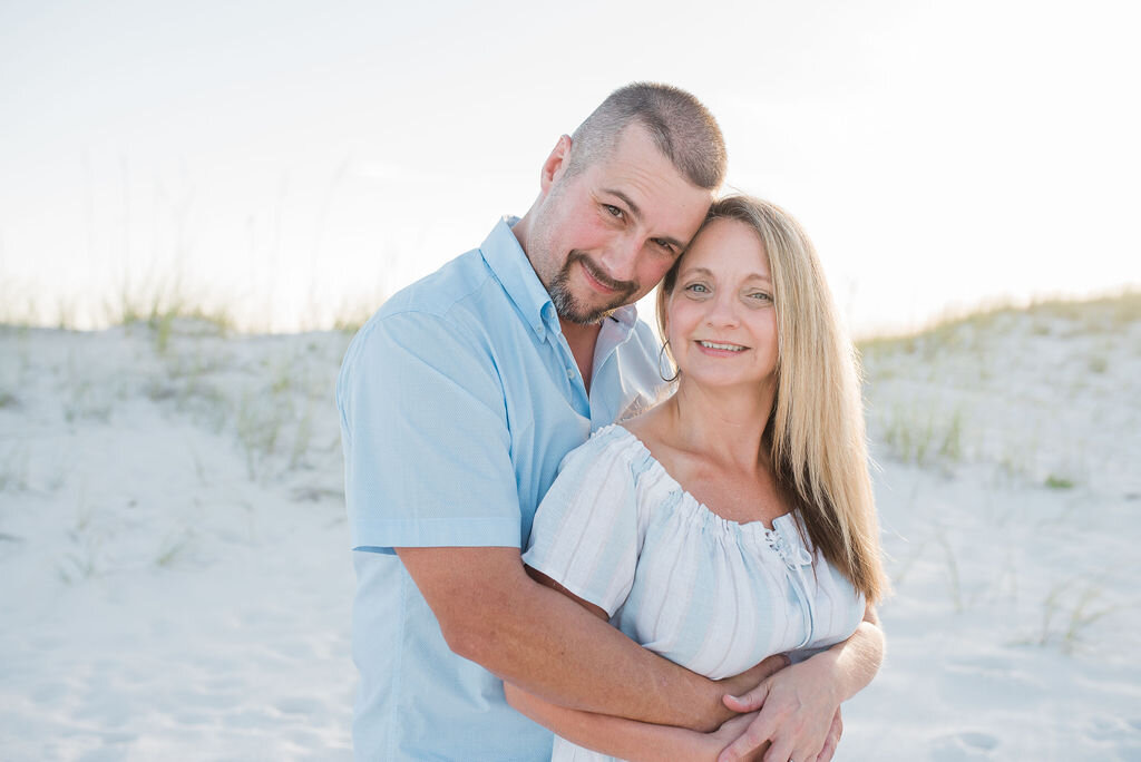 couple by beach-pensacola family photographer