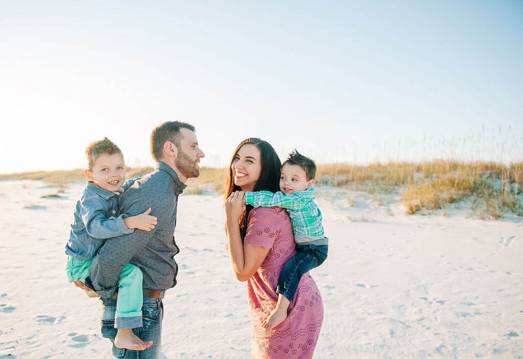family with kids on shoulder-pensacola family photographer
