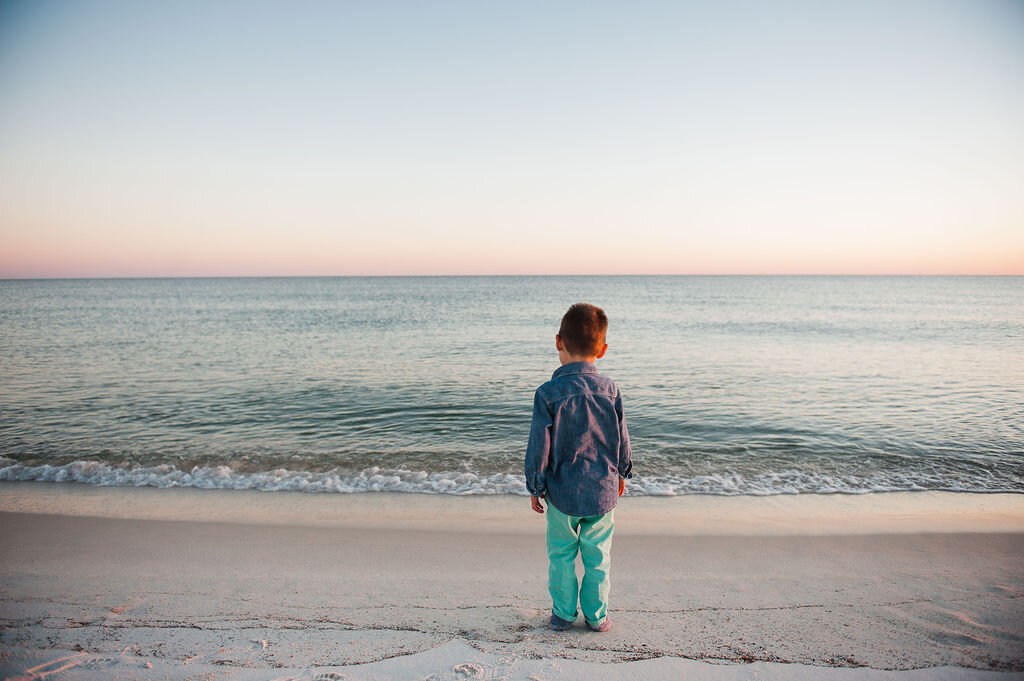 boy by beach-pensacola family photographer