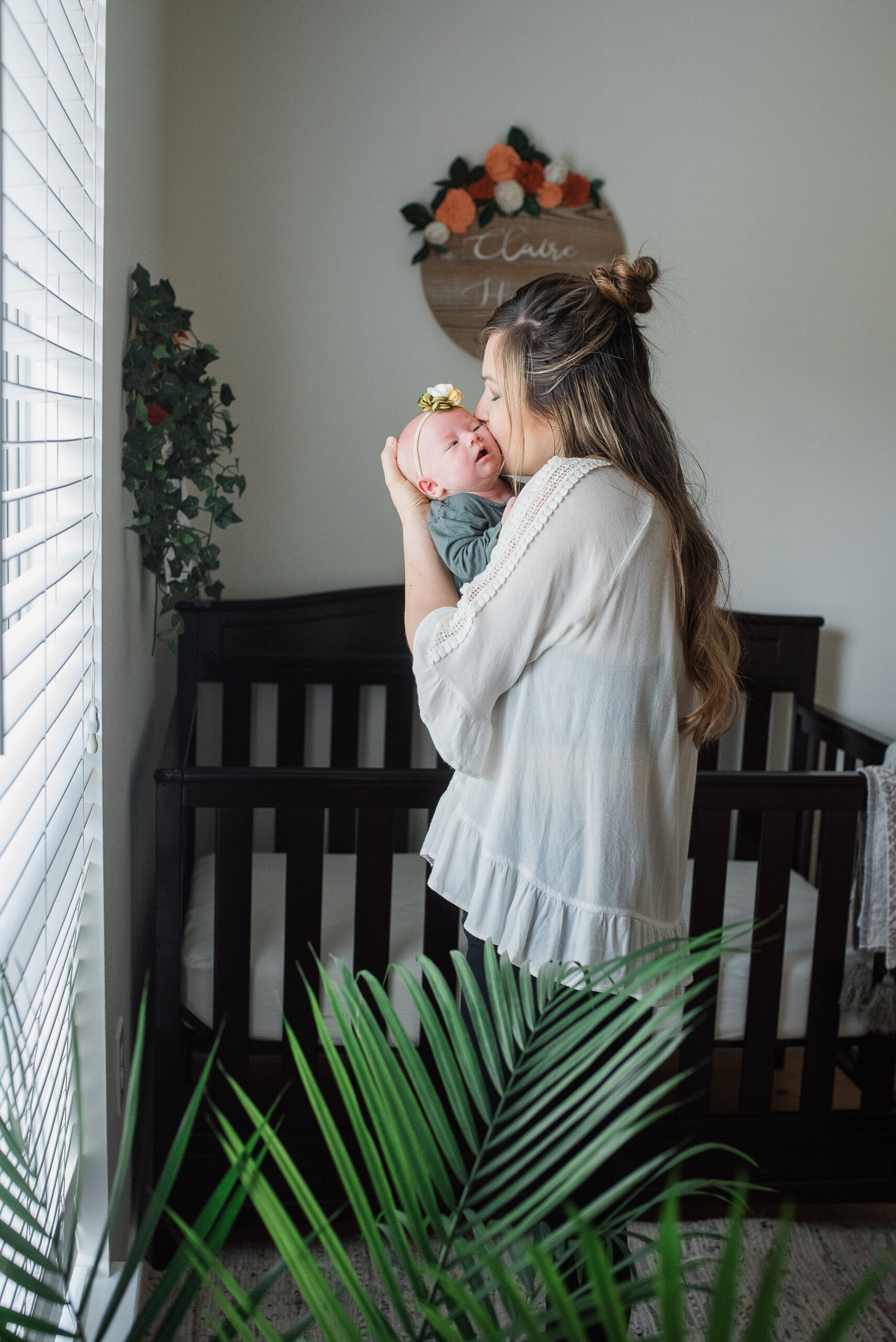 mom kissing baby-pensacola newborn photographer-Ann Mangum Photography