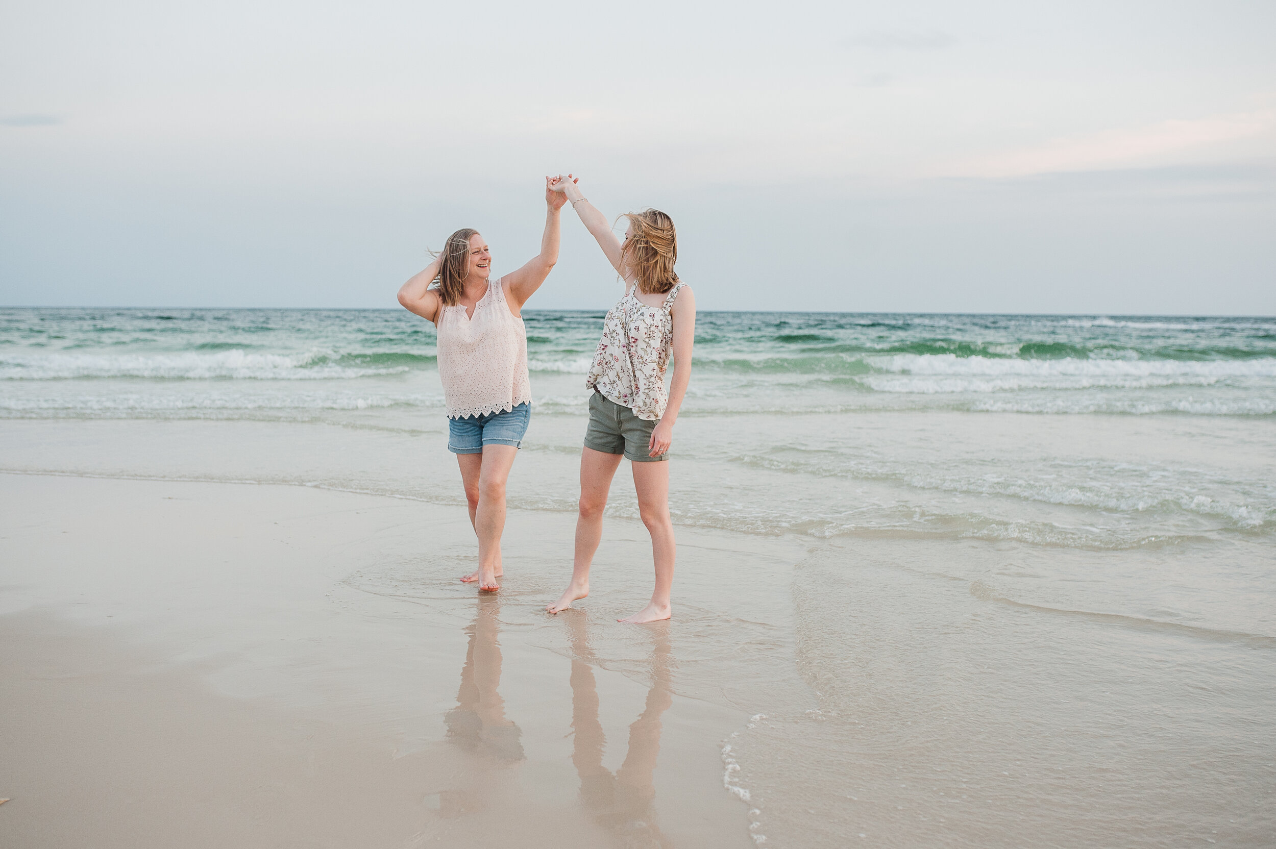 mother and daughter dancing at beach-pensacola beach photographer-Ann Mangum Photography