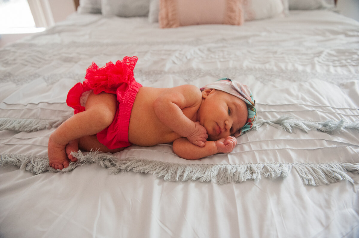 baby on bed-newborn pensacola photographer