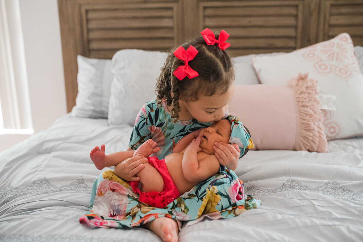 toddler kissing baby-pensacola newborn photographer
