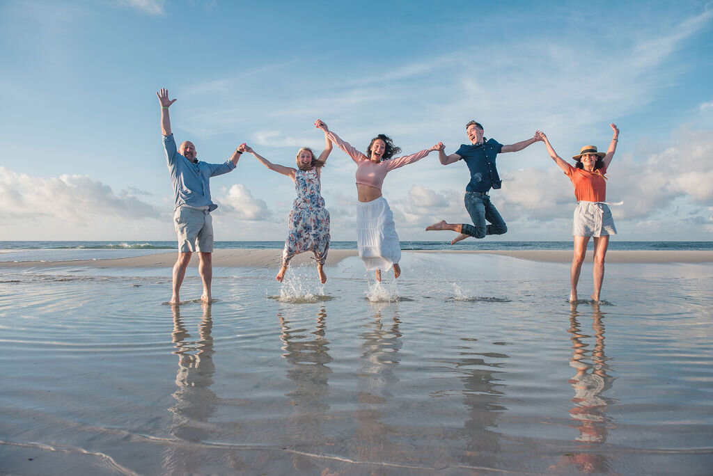 family jumping in water-pensacola family photographer