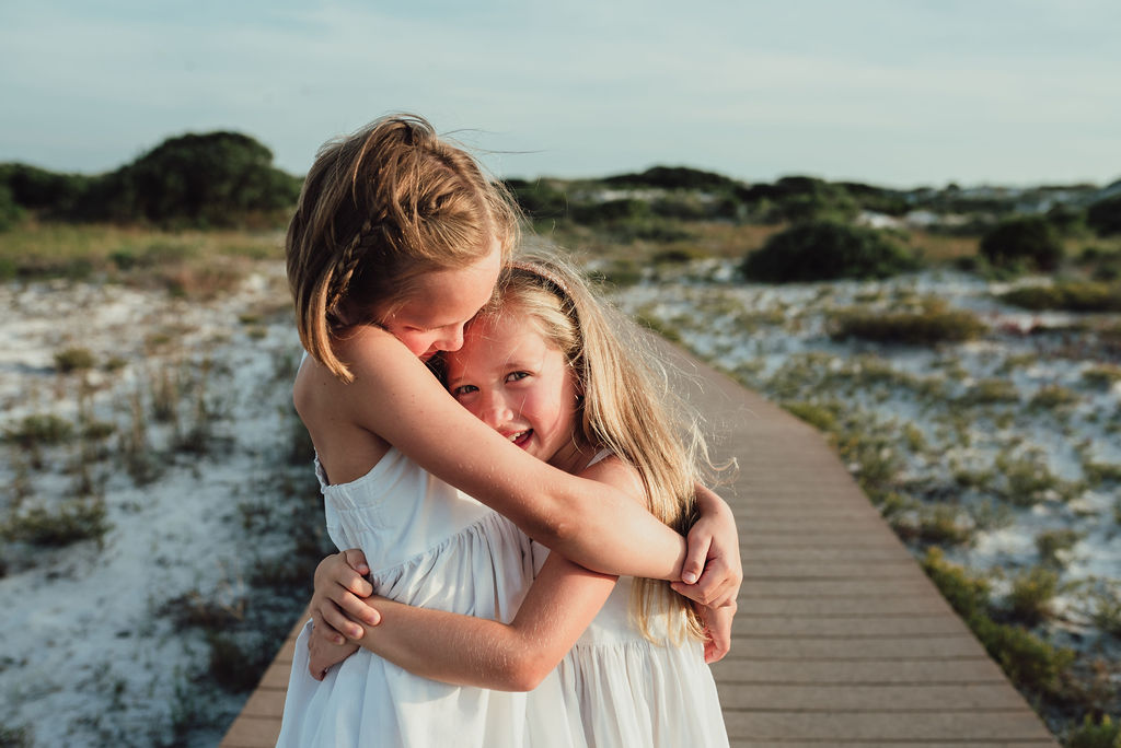 girls hugging-pensacola beach photographer