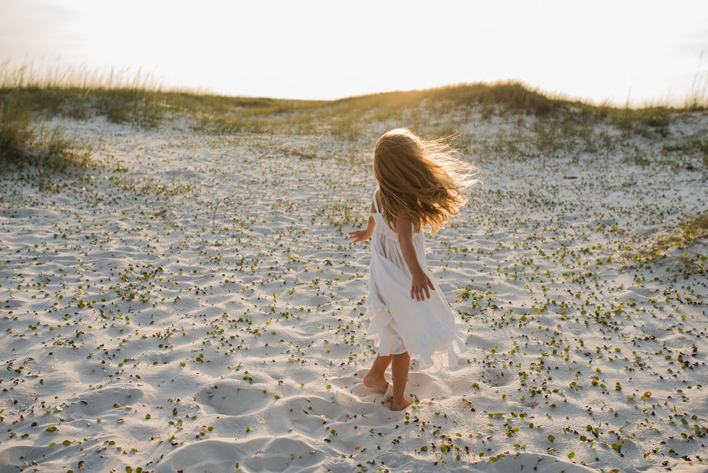 girl walking in dunes-pensacola photographer