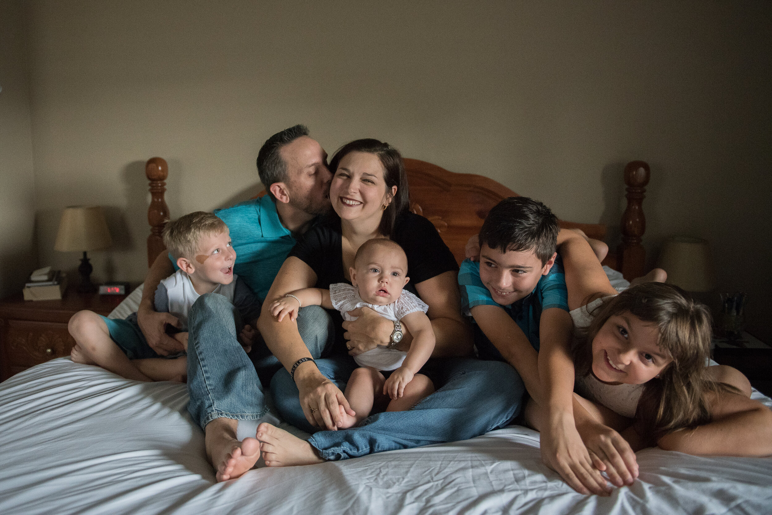 family on bed-pensacola family photographer-Ann Mangum Photography