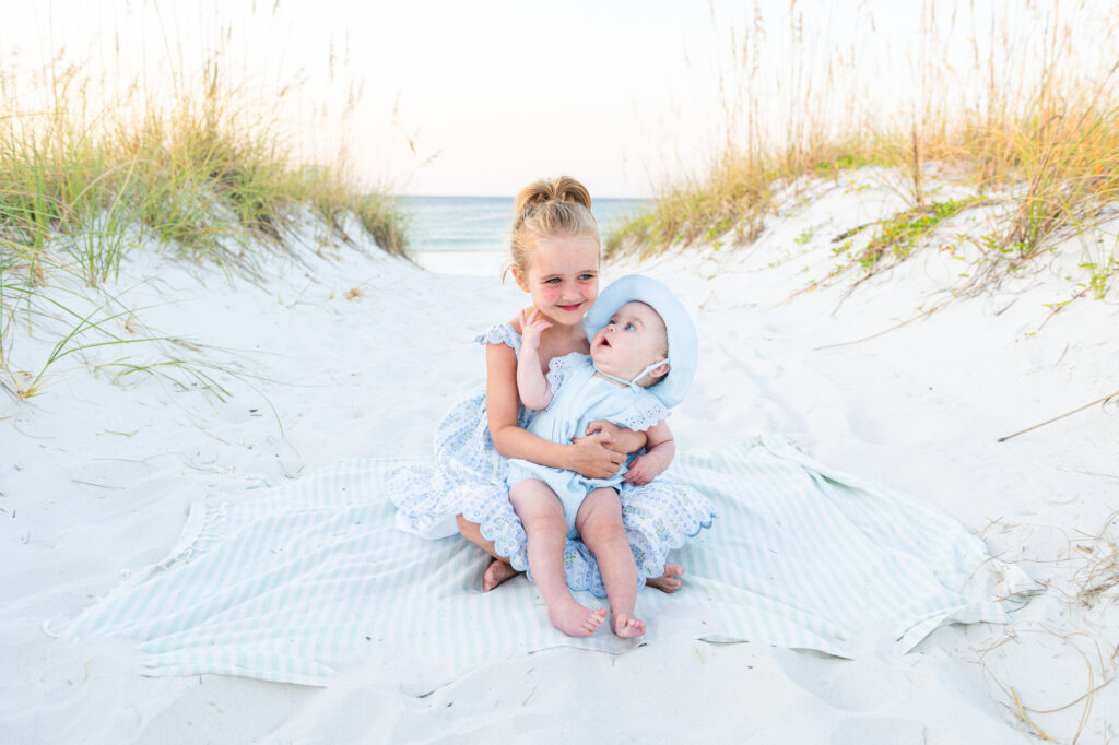 sisters sitting on Pensacola Beach