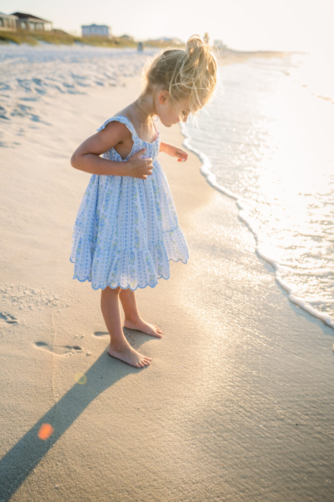 girl by waves at Pensacola Beach