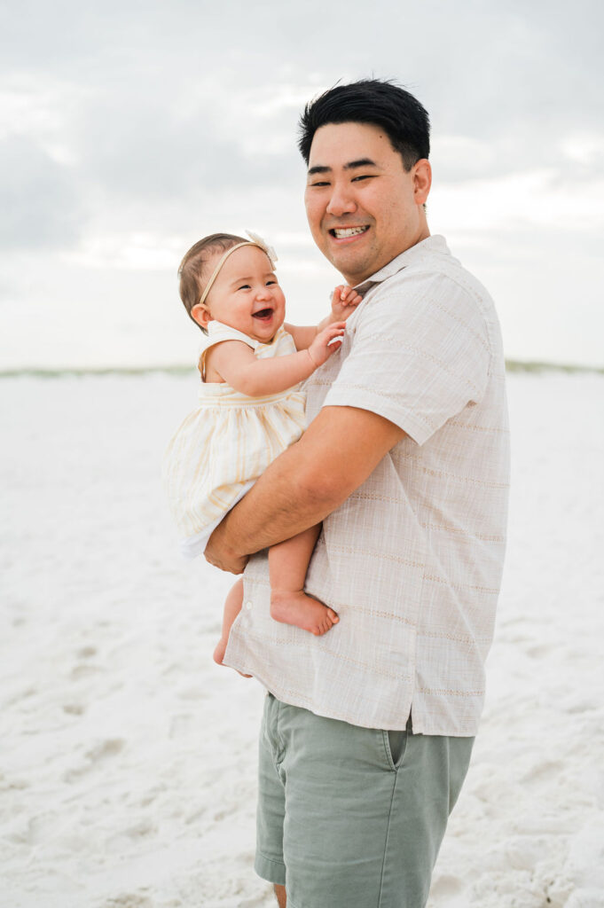 dad holding baby at Pensacola beach